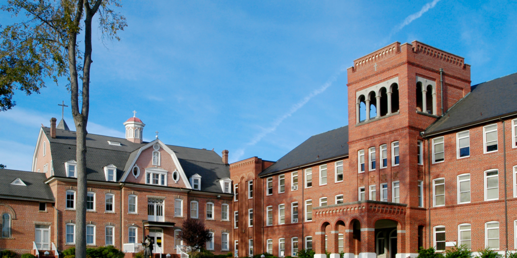 Exterior of a senior school building with red brick walls.